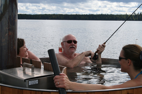 Man is fishing in the hot tub