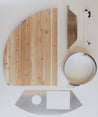 Wooden and stainless steel components of The Firebox Plate, designed for a cedar hot tub assembly.