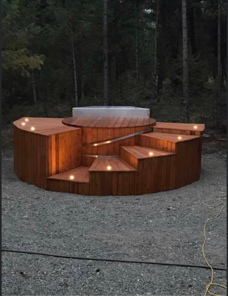 Wood burning hot tub recessed in deck