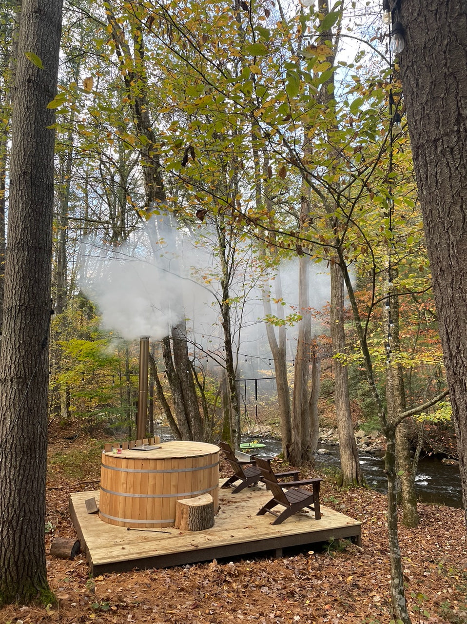 Wood fired hot tub by the river at Riverwood inn