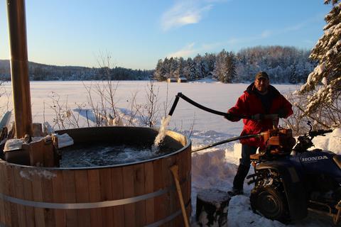 Wood fired hot tub snow