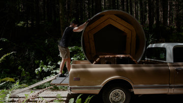 The man puts hot tub into car