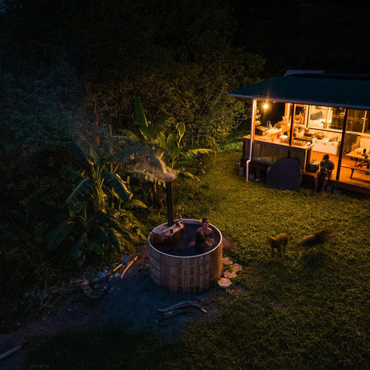 Wood fired hot tub at night 