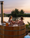 Wood fired hot tub with couple in tub