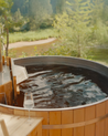 Cedar hot tub with a view of nature