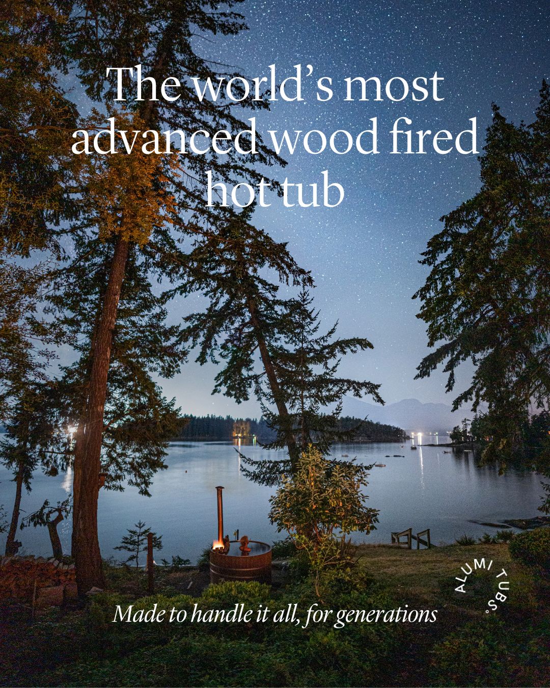 Wood fired hot tub by a serene lake, surrounded by tall trees under a starry night sky.